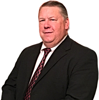 Pictured is our CEO, Courtney Phillips. He is smiling while in his suit.